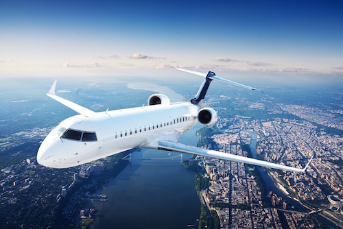 Private jet plane in the blue sky
